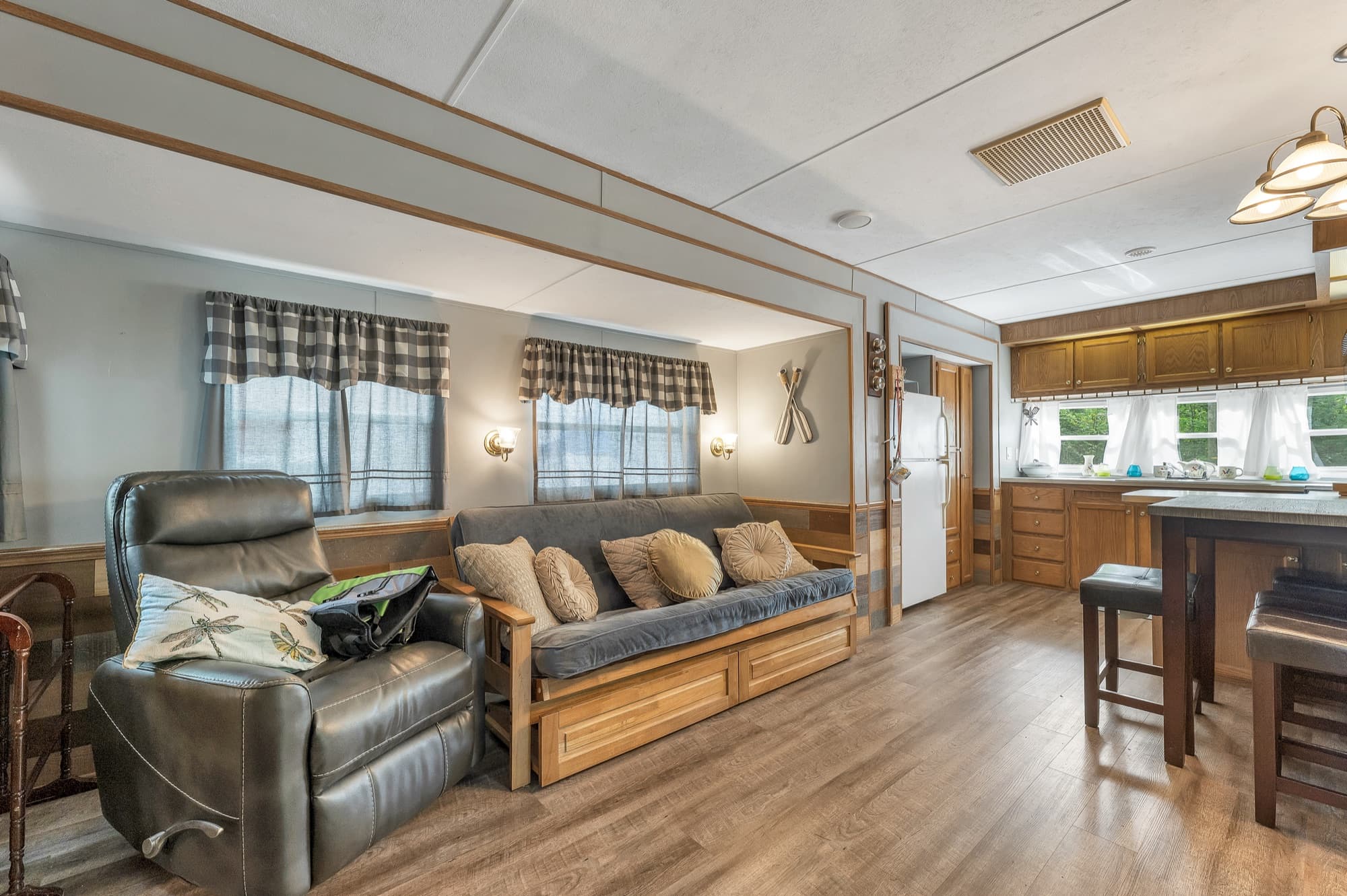 The living area with the recliner and futon, looking toward the kitchen