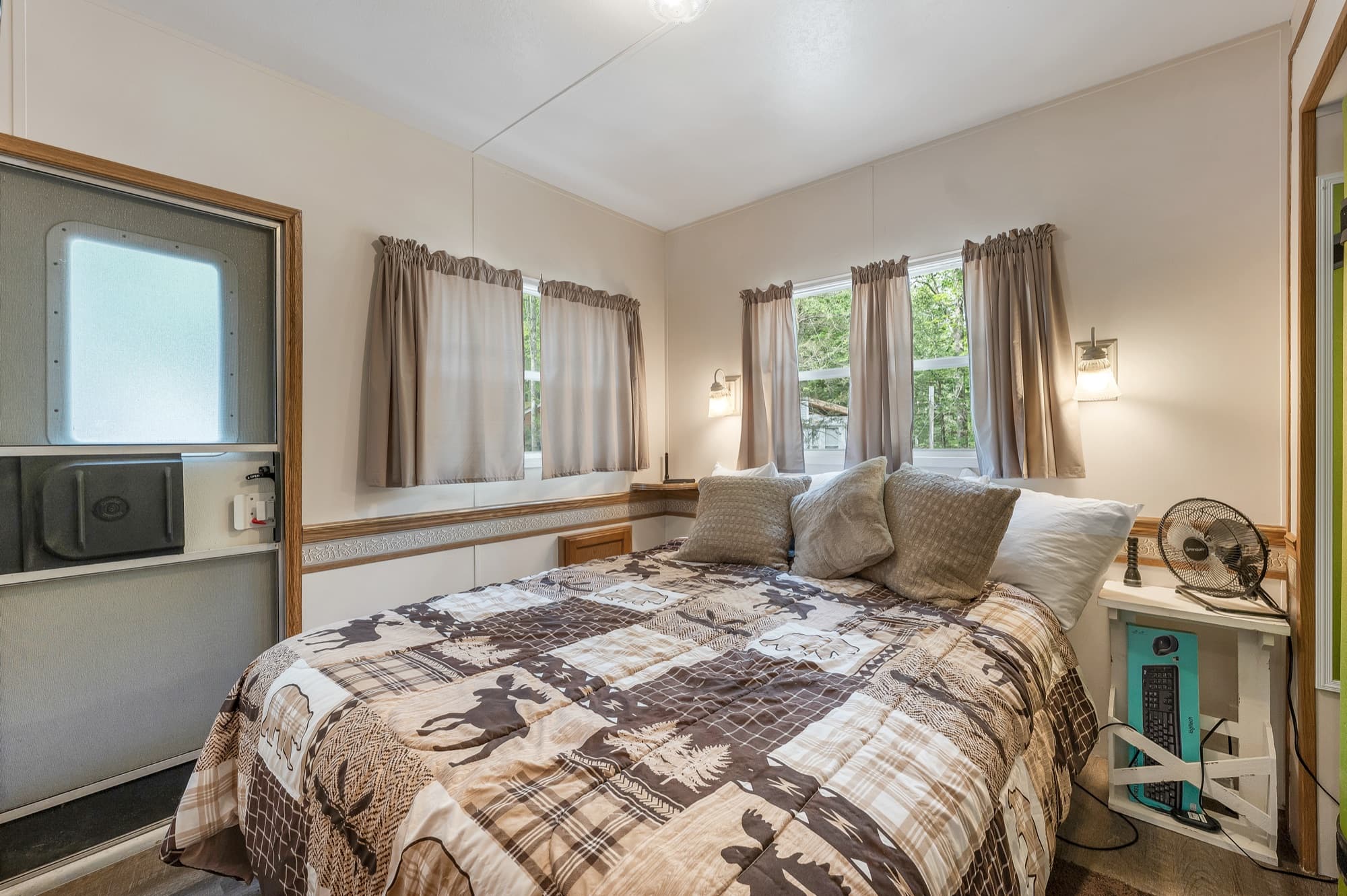 The bedroom at the end of the unit, with windows on 2 sides